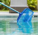 Professional cleaning a residential swimming pool