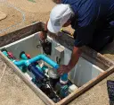 Professional working on pool equipment