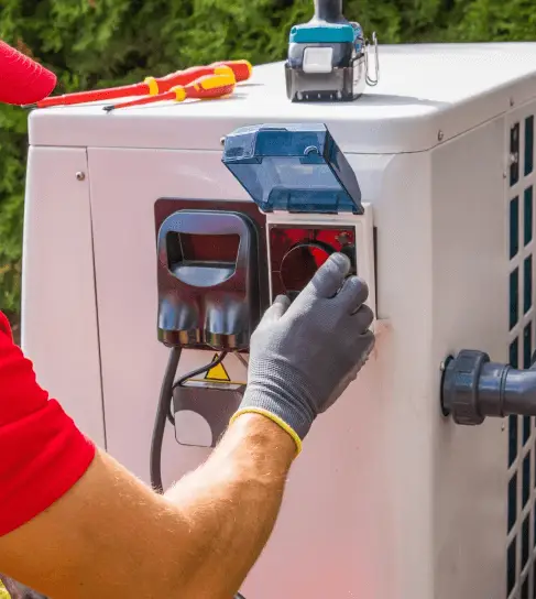 Pool technician working on pool heater